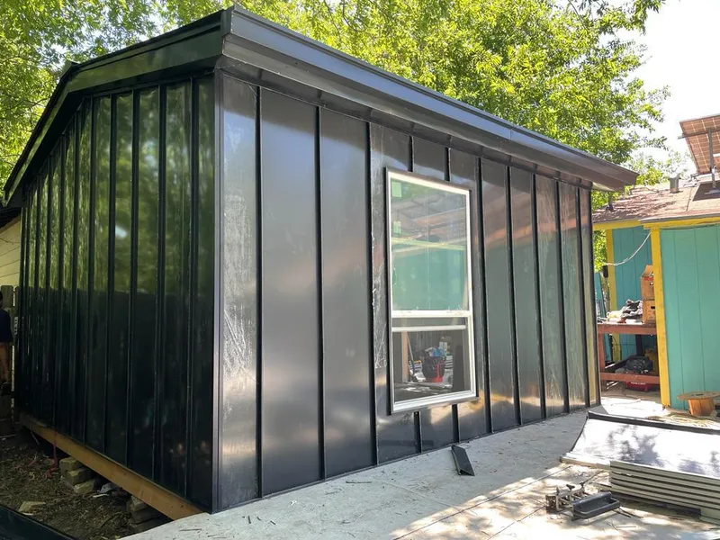 Black standing seam metal wall panels for Roof Inspection in Londonderry